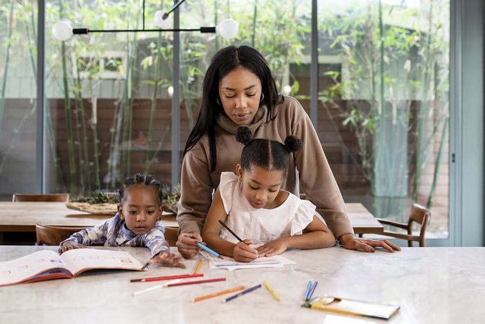 Mother homeschooling kids during the pandemic Mother homeschooling kids during the pandemic